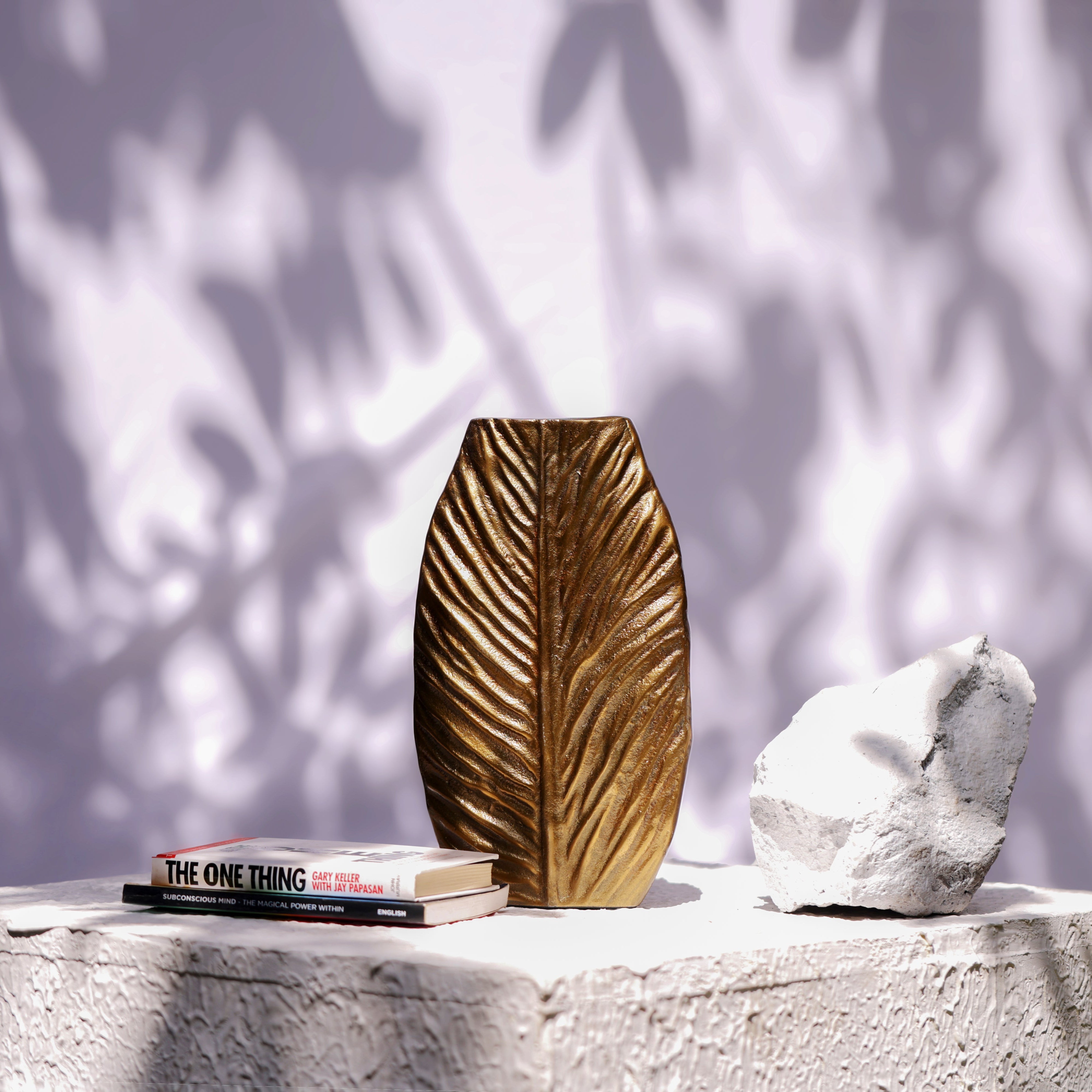 Nexus: An Ornate Leaf Vein Golden Metal Vase in Neoclassical style - Where Symmetrical Grandeur Embraces Natural Detail.