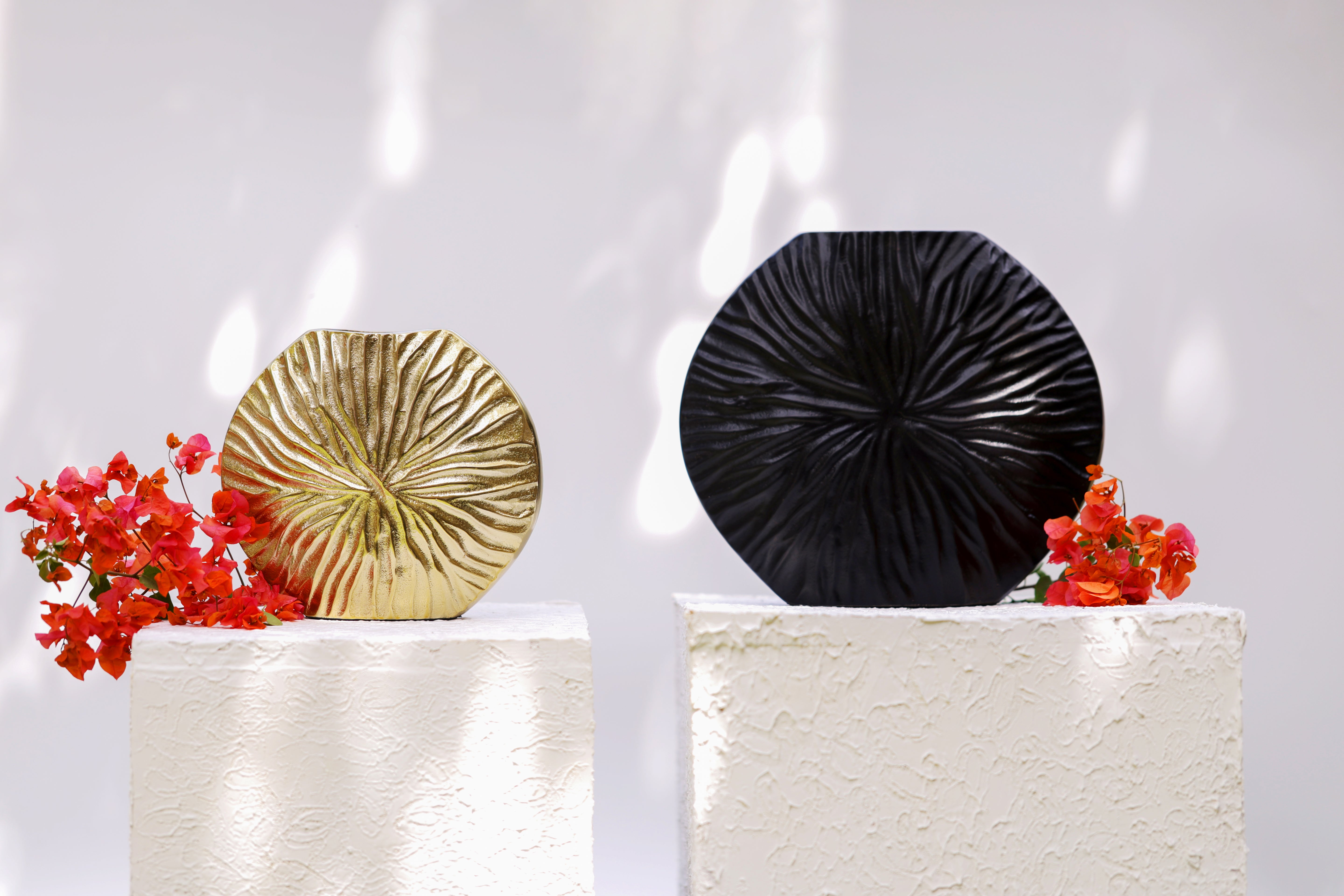 Abyss: A Black Metal Vase in Neoclassical Style with Radial Rays - A Cosmic Dance of Symmetry and Shadow.